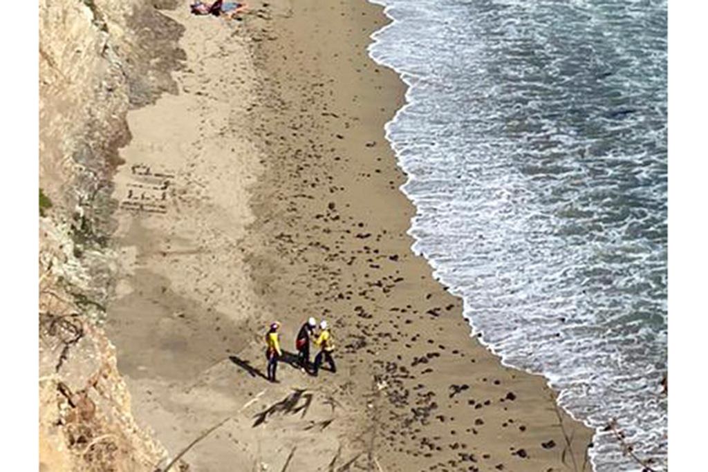 Surfer wrote "HELP" on beach – rescued