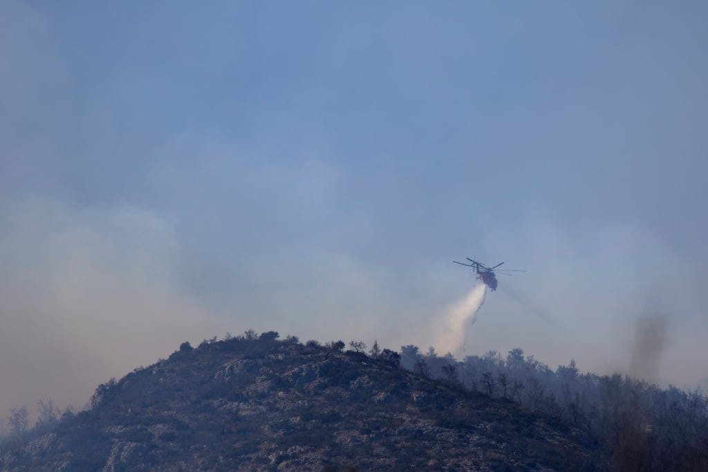Forest fires continue to rage in Greece