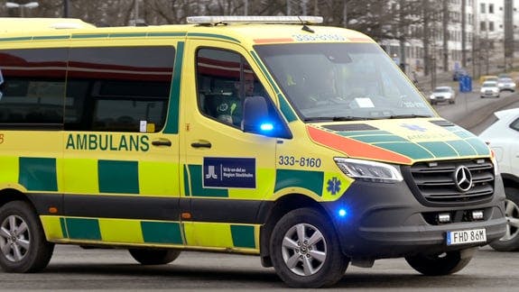Ambulance overturns after collision with A-trailer